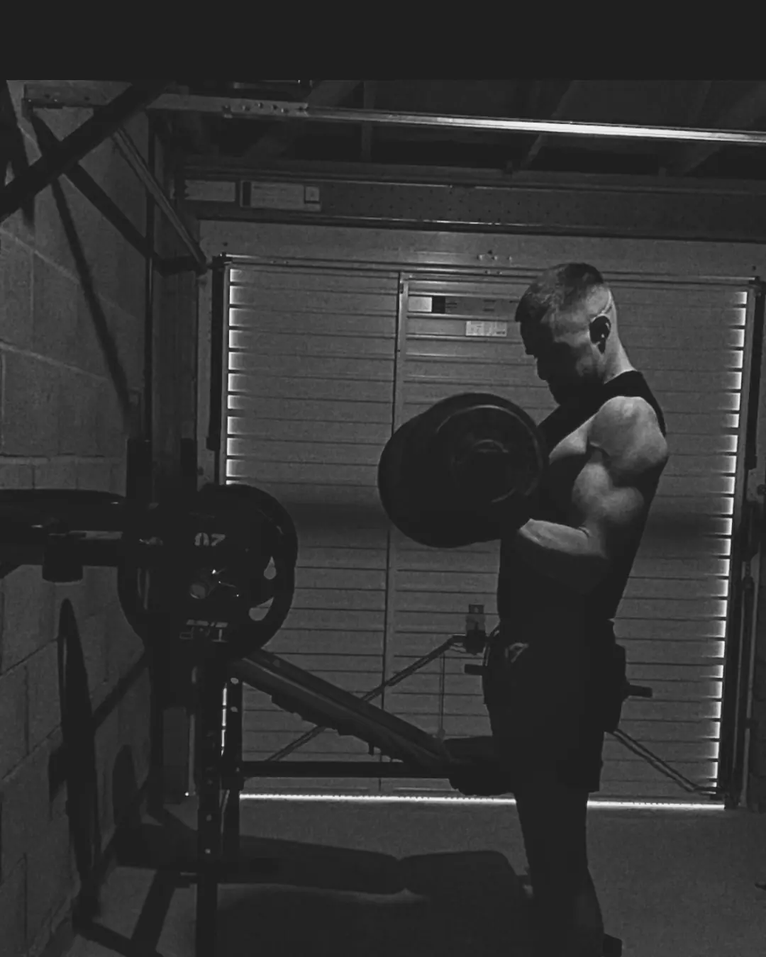 Athlete lifting barbell during a simple strength session